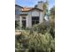 Charming two-story townhome featuring a neutral color, mature landscaping, and a welcoming entrance at 4114 E Union Hills Dr # 1008, Phoenix, AZ 85050