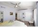 Relaxing bedroom featuring a ceiling fan, en-suite bath access, and a large closet at 4114 E Union Hills Dr # 1088, Phoenix, AZ 85050