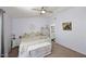 Bright bedroom featuring neutral tones, a ceiling fan, and a chest at the foot of the bed at 4114 E Union Hills Dr # 1088, Phoenix, AZ 85050