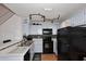 Updated kitchen features white cabinetry, modern appliances and tile backsplash at 4114 E Union Hills Dr # 1088, Phoenix, AZ 85050