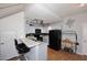 Modern kitchen features black appliances, a breakfast bar, and ample storage space at 4114 E Union Hills Dr # 1088, Phoenix, AZ 85050
