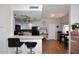 Well-lit kitchen featuring a breakfast bar and open to the dining and living areas at 4114 E Union Hills Dr # 1088, Phoenix, AZ 85050