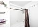 A shower and tub combination with white tiling and a decorative shower curtain at 4114 E Union Hills Dr # 1088, Phoenix, AZ 85050
