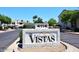 Entrance to community 'The Vistas', with well-maintained landscaping and clear signage at 4114 E Union Hills Dr # 1088, Phoenix, AZ 85050