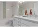 Elegant bathroom featuring double sinks, stone countertops, and subway tile accents at 4335 E Enrose St, Mesa, AZ 85205