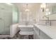 Elegant bathroom with a freestanding tub, glass shower, and marble vanity at 4335 E Enrose St, Mesa, AZ 85205