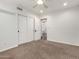 Comfortable bedroom with neutral carpet, ceiling fan and large closet at 4335 E Enrose St, Mesa, AZ 85205