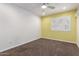 Bright bedroom featuring white walls, carpeted floor and a big window at 4335 E Enrose St, Mesa, AZ 85205