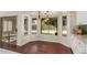 Sunlit breakfast nook with backyard views and dark wood floors at 4335 E Enrose St, Mesa, AZ 85205