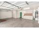 Spacious garage boasts ample storage with custom cabinets and pegboard wall, ready for projects at 4335 E Enrose St, Mesa, AZ 85205