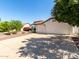 Attractive home with a three-car garage and landscaped front yard at 4335 E Enrose St, Mesa, AZ 85205