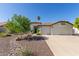 This home features mature landscaping, 3 car garage and a beautiful green lawn at 4335 E Enrose St, Mesa, AZ 85205