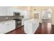 Close up of the kitchen featuring stainless steel appliances, an island, and mosaic backsplash at 4335 E Enrose St, Mesa, AZ 85205