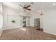 Bright and airy living room with neutral carpet, a modern ceiling fan and sliding barn doors at 4335 E Enrose St, Mesa, AZ 85205