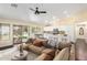 Stylish living room flows into a bright kitchen with a center island, perfect for entertaining and modern living at 4335 E Enrose St, Mesa, AZ 85205