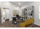 Bright office featuring a dark desk and black shelving, offering a stylish work-from-home space at 4335 E Enrose St, Mesa, AZ 85205