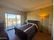 Bright bedroom with balcony access, natural light, and wood floors at 4750 N Central Ave # R3, Phoenix, AZ 85012