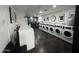 Community laundry room with multiple washing machines at 4750 N Central Ave # R3, Phoenix, AZ 85012