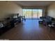 Spacious living room with hardwood floors, comfortable seating, and sliding glass doors to a balcony at 4750 N Central Ave # R3, Phoenix, AZ 85012