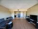 Bright living room featuring wood-look floors, and an open floor plan to a kitchen at 4750 N Central Ave # R3, Phoenix, AZ 85012