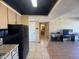 Open-concept living space that connects the kitchen, hallway, and living area with appliances at 4750 N Central Ave # R3, Phoenix, AZ 85012