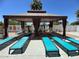 Relaxing pool area featuring a shaded cabana and lounge chairs for enjoying sunny days at 4750 N Central Ave # R3, Phoenix, AZ 85012