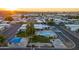 Aerial view of the community pool, seating, shade area, and surrounding manufactured homes at 535 S Alma School Rd # 17, Mesa, AZ 85210