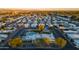 Expansive aerial view showcasing the community layout, mature trees, and a variety of homes at 535 S Alma School Rd # 17, Mesa, AZ 85210