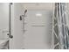 Accessible bathroom with tiled walk-in shower and safety bars at 535 S Alma School Rd # 17, Mesa, AZ 85210