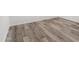 Freshly installed, light brown vinyl plank flooring is shown at 535 S Alma School Rd # 17, Mesa, AZ 85210