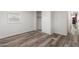 Bedroom with wood-look vinyl floors, window, and closet at 535 S Alma School Rd # 17, Mesa, AZ 85210
