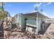 Exterior view featuring gravel, a storage shed, and covered parking at 535 S Alma School Rd # 17, Mesa, AZ 85210
