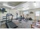 Community fitness center with several exercise machines and a TV at 535 S Alma School Rd # 17, Mesa, AZ 85210
