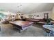 Recreational game room with pool tables, lounge area, and bar seating for residents' entertainment and leisure at 535 S Alma School Rd # 17, Mesa, AZ 85210