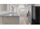 Stylish kitchen with a breakfast bar, stainless steel appliances, and new hardwood floors at 535 S Alma School Rd # 17, Mesa, AZ 85210