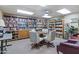 Inviting library area featuring well-stocked bookshelves, a round table with chairs, and reading nooks at 535 S Alma School Rd # 17, Mesa, AZ 85210