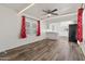 Bright living room with hardwood floors, white walls, and a ceiling fan at 535 S Alma School Rd # 17, Mesa, AZ 85210