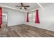 Spacious living room featuring hardwood floors, ample natural light, and fresh white paint at 535 S Alma School Rd # 17, Mesa, AZ 85210