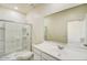 Modern bathroom featuring a glass-enclosed shower, white vanity with sink, and a large mirror for a bright and clean look at 5781 E Iris Dr, Florence, AZ 85132