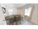 Bright dining area with natural light, neutral colors, and contemporary furniture that creates a welcoming atmosphere at 5781 E Iris Dr, Florence, AZ 85132