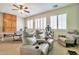 Recreational room with theatre seating, a ping pong table, and a ceiling fan at 6027 N 132Nd Dr, Litchfield Park, AZ 85340
