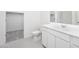 Bathroom with a modern vanity, white cabinets, white toilet, and a walk-in shower at 6057 E Artemis Dr, Florence, AZ 85132