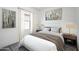 Inviting bedroom featuring a comfortable queen-sized bed, soft lighting, and modern decor at 6057 E Artemis Dr, Florence, AZ 85132