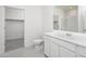 Bright bathroom with a large mirror, white cabinets, and a walk-in closet at 6064 E Artemis Dr, Florence, AZ 85132