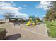 Community park featuring playground equipment, a shaded picnic area, and benches for relaxation at 6064 E Artemis Dr, Florence, AZ 85132