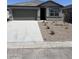 Single-story home featuring a two-car garage and low-maintenance landscaping at 6064 E Artemis Dr, Florence, AZ 85132