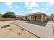 Expansive backyard with a brick patio, a block wall, and lots of space for outdoor activities and entertaining at 6103 S 54Th Ave, Laveen, AZ 85339