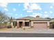 Inviting single-story home with desert landscaping and a two-car garage at 6103 S 54Th Ave, Laveen, AZ 85339