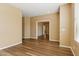 Open-concept living room with beautiful wood-look floors and neutral paint at 6103 S 54Th Ave, Laveen, AZ 85339
