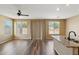 Bright living room featuring wood floors, natural light, and neutral colored walls at 6103 S 54Th Ave, Laveen, AZ 85339